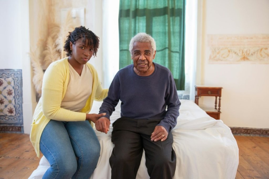 Nurse providing care to elderly woman